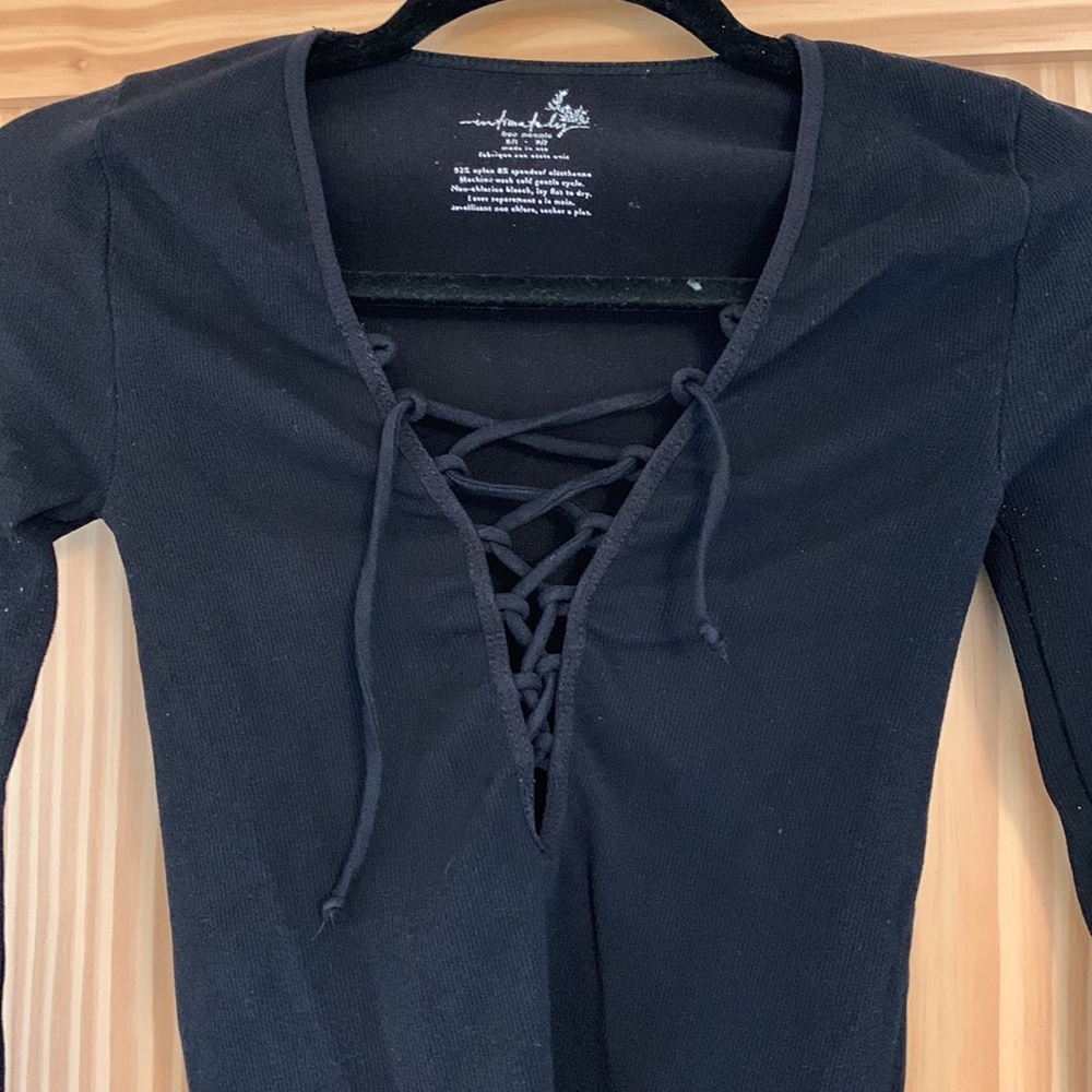 Free people stretchy black top with tie front. Size XS/S